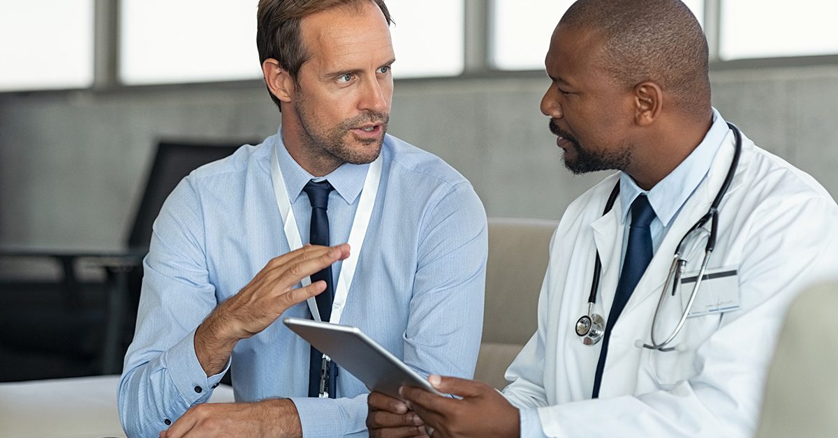 Stock image of doctors talking in a hospital
